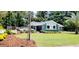 Charming single-story home with well-manicured lawn, fresh mulch beds and mature landscaping at 811 Fairview Ave, Altamonte Springs, FL 32701