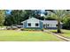 Single-story home with fresh landscaping and a healthy palm tree in the front yard at 811 Fairview Ave, Altamonte Springs, FL 32701