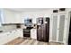Well-lit kitchen featuring stainless steel appliances, white cabinets, and ample counter space at 811 Fairview Ave, Altamonte Springs, FL 32701