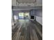 Living room features modern flooring, fireplace and sliding glass doors leading to the backyard pool at 811 Fairview Ave, Altamonte Springs, FL 32701
