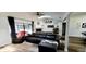 Inviting living room showcasing a fireplace, modern sofa, and natural light at 811 Fairview Ave, Altamonte Springs, FL 32701