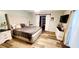 Comfortable main bedroom with neutral tones, barn door and ample natural light at 811 Fairview Ave, Altamonte Springs, FL 32701