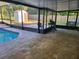 Screened-in pool area with brick pavers, pool, and a shed in the backyard at 811 Fairview Ave, Altamonte Springs, FL 32701