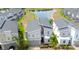 Beautiful aerial view of a modern home with neutral exterior paint near a calm pond at 8912 Cabot Cliffs Dr, Davenport, FL 33896