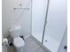 Bright bathroom featuring a walk-in shower and toilet at 8912 Cabot Cliffs Dr, Davenport, FL 33896
