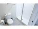Bright bathroom featuring a walk-in shower and toilet at 8912 Cabot Cliffs Dr, Davenport, FL 33896