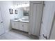 Bright bathroom with double vanity, large mirror, and clean white cabinetry at 8912 Cabot Cliffs Dr, Davenport, FL 33896