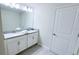 Bright bathroom featuring a double vanity with neutral countertops at 8912 Cabot Cliffs Dr, Davenport, FL 33896