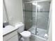Modern bathroom featuring a glass-enclosed shower, contemporary fixtures, and neutral tile at 8912 Cabot Cliffs Dr, Davenport, FL 33896