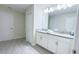 Bright bathroom featuring a double vanity and tile floors at 8912 Cabot Cliffs Dr, Davenport, FL 33896