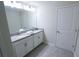 Bright bathroom featuring a double vanity with a neutral countertop at 8912 Cabot Cliffs Dr, Davenport, FL 33896