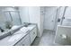 Bright bathroom featuring double vanity and glass shower at 8912 Cabot Cliffs Dr, Davenport, FL 33896