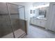 Bathroom featuring glass shower, double vanity and clean design at 8912 Cabot Cliffs Dr, Davenport, FL 33896
