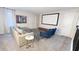 Bright bonus room with comfy seating and a large projector screen at 8912 Cabot Cliffs Dr, Davenport, FL 33896