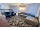 Entertainment bonus room boasts theater screen and a modern black and white carpet at 8912 Cabot Cliffs Dr, Davenport, FL 33896
