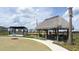 Relaxing community area with thatched hut and shaded pergola, ideal for gatherings and outdoor enjoyment at 8912 Cabot Cliffs Dr, Davenport, FL 33896