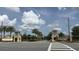 Inviting community entrance marked by decorative signage, lush landscaping, and a welcoming atmosphere at 8912 Cabot Cliffs Dr, Davenport, FL 33896