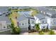 Inviting two-story home with gray roof and manicured landscaping near tranquil pond at 8912 Cabot Cliffs Dr, Davenport, FL 33896