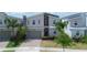 Charming two-story home with modern architecture, a brick driveway, and a convenient two-car garage at 8912 Cabot Cliffs Dr, Davenport, FL 33896
