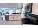 Modern kitchen with an island, stainless steel appliances, and an open layout to living areas at 8912 Cabot Cliffs Dr, Davenport, FL 33896