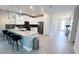 Charming kitchen features a center island with seating and stainless steel appliances at 8912 Cabot Cliffs Dr, Davenport, FL 33896