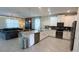 Spacious open floor plan featuring modern kitchen with island and comfortable living area at 8912 Cabot Cliffs Dr, Davenport, FL 33896