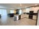 Open floor plan featuring a modern kitchen and comfortable living area with sectional sofa at 8912 Cabot Cliffs Dr, Davenport, FL 33896