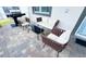 Cozy screened patio seating area with comfortable furniture and a stainless-steel grill at 8912 Cabot Cliffs Dr, Davenport, FL 33896