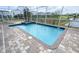 Refreshing pool with attached spa and beautiful brick patio offers a relaxing outdoor oasis at 8912 Cabot Cliffs Dr, Davenport, FL 33896