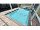 Refreshing pool with blue tile and spa offers a relaxing oasis within a screened enclosure at 8912 Cabot Cliffs Dr, Davenport, FL 33896
