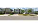 Contemporary homes line the street, showcasing well-manicured lawns and convenient two-car garages at 8912 Cabot Cliffs Dr, Davenport, FL 33896
