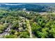 Aerial view featuring lush tree coverage and beautiful homes that provides a serene living experience at 102 Wild Plum Ln, Longwood, FL 32779