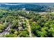 Aerial view featuring lush tree coverage and beautiful homes that provides a serene living experience at 102 Wild Plum Ln, Longwood, FL 32779