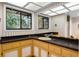 Bathroom featuring a large countertop with two windows, a sink, and lots of storage underneath the sink and countertop at 102 Wild Plum Ln, Longwood, FL 32779