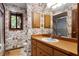 Bathroom featuring a sink, mirror, cabinet, and window at 102 Wild Plum Ln, Longwood, FL 32779