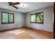 Bedroom featuring two windows with views of the outdoors at 102 Wild Plum Ln, Longwood, FL 32779