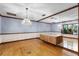 Dining room featuring hardwood floors, mirror wall, and vintage chandelier lighting at 102 Wild Plum Ln, Longwood, FL 32779