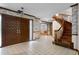 Elegant foyer with curved staircase and decorative wood doors at 102 Wild Plum Ln, Longwood, FL 32779