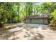 Spacious two car garage with mature trees surrounding at 102 Wild Plum Ln, Longwood, FL 32779