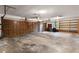 Spacious garage with wooden doors and shelving at 102 Wild Plum Ln, Longwood, FL 32779