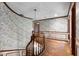 A staircase leads to the upper level of this residence, decorated with patterned wallpaper at 102 Wild Plum Ln, Longwood, FL 32779