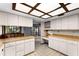 Spacious kitchen with bright lighting, ample cabinet space, and tile flooring at 102 Wild Plum Ln, Longwood, FL 32779