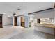 Open-concept kitchen and living space with tile floors and a breakfast bar at 102 Wild Plum Ln, Longwood, FL 32779