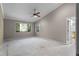 Spacious primary bedroom with large windows providing natural light and ceiling fan at 102 Wild Plum Ln, Longwood, FL 32779