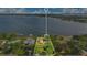 Lakefront property with lush greenery, neighboring houses, and docks, offering a serene and picturesque setting at 10577 Down Lakeview Cir, Windermere, FL 34786
