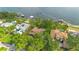 Gorgeous waterfront homes, mature trees, swimming pool, and views of the lake at 10577 Down Lakeview Cir, Windermere, FL 34786
