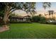 Expansive lawn and beautiful home with rear lanai are perfect for outdoor enjoyment and entertainment at 10577 Down Lakeview Cir, Windermere, FL 34786