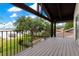 Inviting home balcony with scenic views of a pool, landscaping, and lake at 10577 Down Lakeview Cir, Windermere, FL 34786