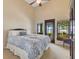 Bedroom with vaulted ceilings offering water views, and plenty of natural light at 10577 Down Lakeview Cir, Windermere, FL 34786