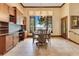 Elegant dining area featuring natural light, custom wood cabinetry, and a view to the water at 10577 Down Lakeview Cir, Windermere, FL 34786